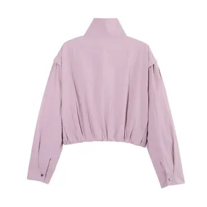 Back view of a pink lightweight cropped sun protection jacket with stand collar and elastic hem