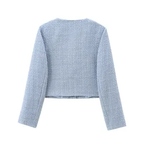 Detailed back view of a stylish light blue round-neck tweed jacket for autumn wear