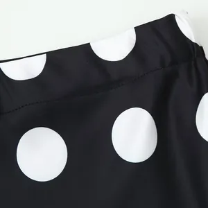 Close-up detail showing the high-quality black and white polka dot fabric and neat stitching