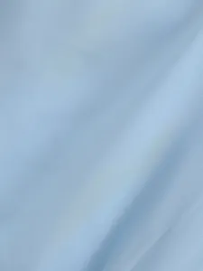 Primo piano macro della fine trama del tessuto intrecciato azzurro