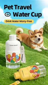 Detail of portable pet water cups featured in a bright outdoor setting with a corgi dog