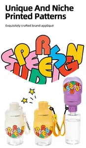 Detail of portable pet water bottle with colorful letter appliqué and carrying strap