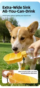 Close-up of a corgi drinking from a portable pet water bottle with an extra-wide yellow sink