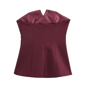 Detailed view of burgundy strapless tube top with V-neckline and structural seams