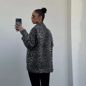 Back view of a trendy oversized leopard print denim jacket with a classic collar.