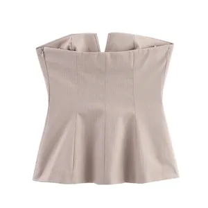 Detailed view of a chic pinstriped strapless top featuring a side zipper and slim fit