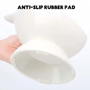 White elevated ceramic cat bowl featuring four anti-slip rubber pads for stability