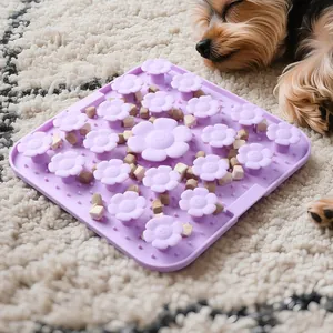 Purple flower-shaped silicone pet slow feeder mat for dogs and cats on soft white rug