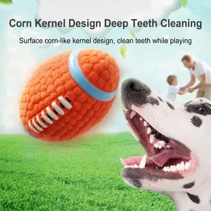 Durable orange plush football dog toy with corn kernel texture for teeth cleaning