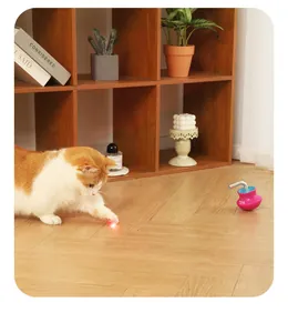 Automatic tumbler cat toy with red laser pointer for indoor cats in home setting