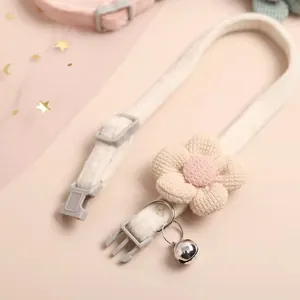 Soft adjustable pet collar featuring a cute knitted flower and a small silver bell