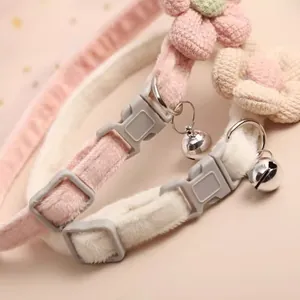 Adjustable plush pet collar featuring a cute knit flower and silver bell for dogs and cats