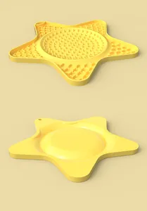 Tapis de léchage en silicone jaune en forme d'étoile montrant les détails recto et verso