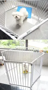 Detailed view of white metal modular playpen for pets and infants in an indoor setting