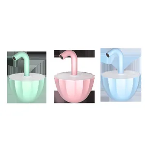 Set of three colorful electric cat laser toys in pastel green, pink, and blue dome designs.