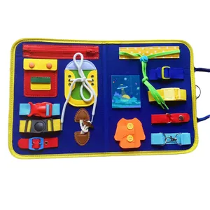 Detail view of Montessori busy board with buckles, zippers, and laces for toddlers