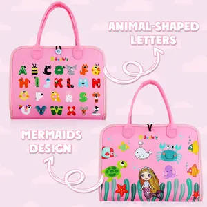 Detailed view of pink Montessori busy board with animal letters and mermaid themes