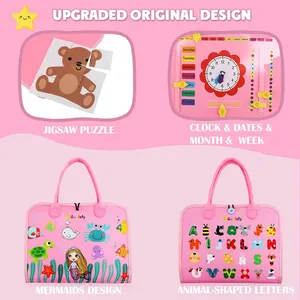 Detail view of pink felt busy board showing clock, puzzle, and animal letters.