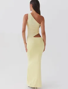 Elegant back view of a pale yellow one-shoulder maxi dress with side cutout detail