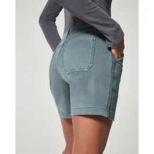 Detailed view of women's blue stretch twill shorts showing back pocket and seam work