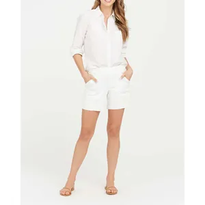 Women's white stretch twill canvas shorts paired with a matching white shirt outfit