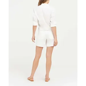 Rear view detail of women's white stretch twill canvas denim shorts with pockets