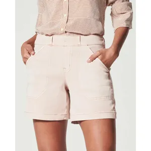 Detail of women's light pink stretch canvas shorts with large front utility pockets