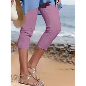 Detailansicht der rosa, eng anliegenden und atmungsaktiven Capri-Leggings für Damen