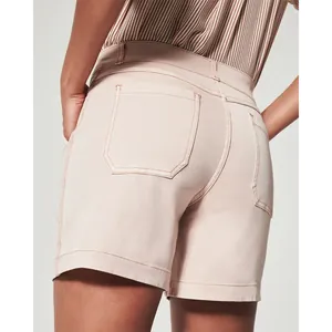 Back detail view of women's stretch twill canvas shorts in pale pink with pockets