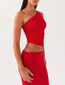 Detailed view of a red one-shoulder bodycon knit dress with stylish waist cutout