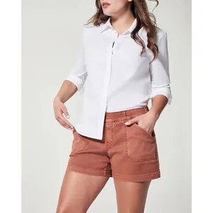 Close-up of women's terracotta stretch canvas shorts with large utility side pockets