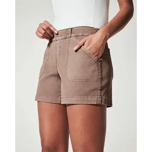 Close-up of women's brown stretch twill canvas shorts with large front pockets