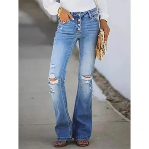 Vista completa di jeans a zampa a vita alta con bottoni multipli in lavaggio vintage