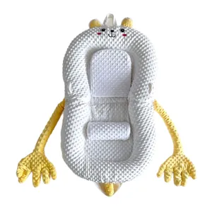 White baby lounger with yellow soothing arm pillows and soft dot velvet texture for newborns