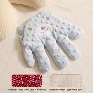 Cojín relajante para bebés con relleno de frijol rojo y capa trasera transpirable.