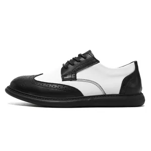 Detailed side view of black and white leather Brogue shoes with classic wingtip perforated patterns