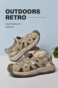 Close-up view of khaki men's outdoor sandals with mesh panels and rotary buckle system.