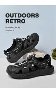 Detailed view of men's black outdoor sandals with mesh upper and rotary buckle system