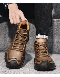 Close-up shot of durable vintage brown men's leather boots with handmade stitching