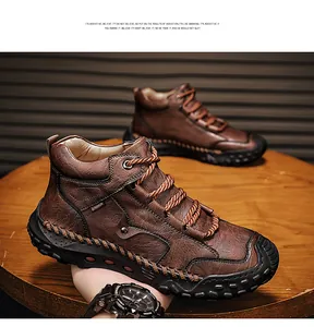 Detail view of brown men's leather boots featuring exquisite hand-stitched craftsmanship