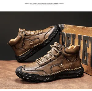 Macro view of handmade stitching details on brown leather high-top outdoor boots for men.
