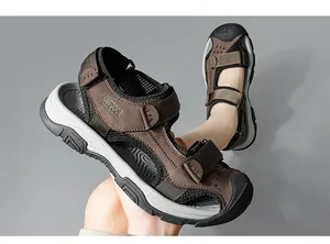 Detailed view of men's leather outdoor sandals featuring closed-toe and mesh panels