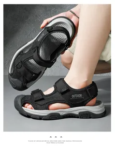 Detailed view of men's black leather outdoor sandals with secure velcro straps