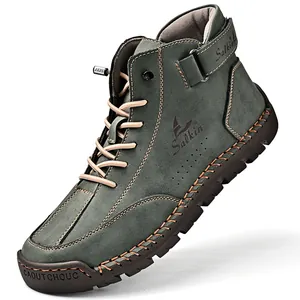 Detailed view of green high-top leather Martin boots with hand-stitched sole edges