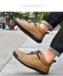 Close-up of tan leather outdoor casual boots with hand-stitched welt and side zipper