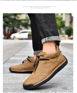 Close-up of hand-stitched outdoor casual leather boots with a front zipper detail.