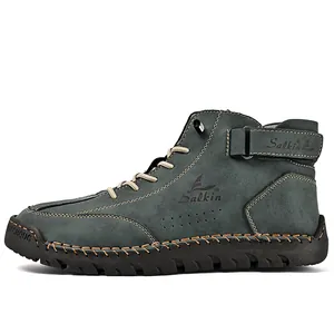 Detailed side view of grey hand-stitched high-top men's outdoor casual leather boots