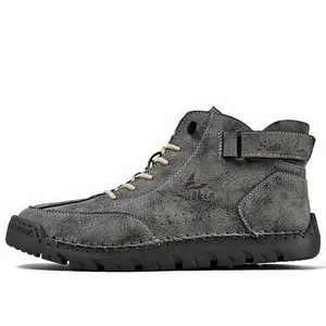 Side view of grey hand-stitched high-top men's outdoor casual Martin boots in premium leather