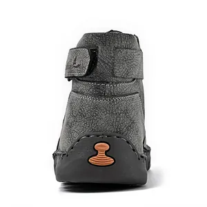 Rear view detail of men's grey high-top leather boots with crackle finish and hand-stitched sole