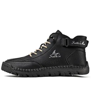 Side view of high-top leather boots with hand-stitched detailing and textured finish
